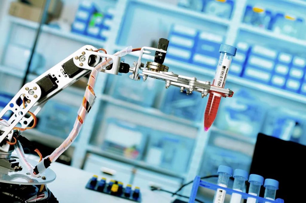 Robotic equipment holding a test tube in a laboratory